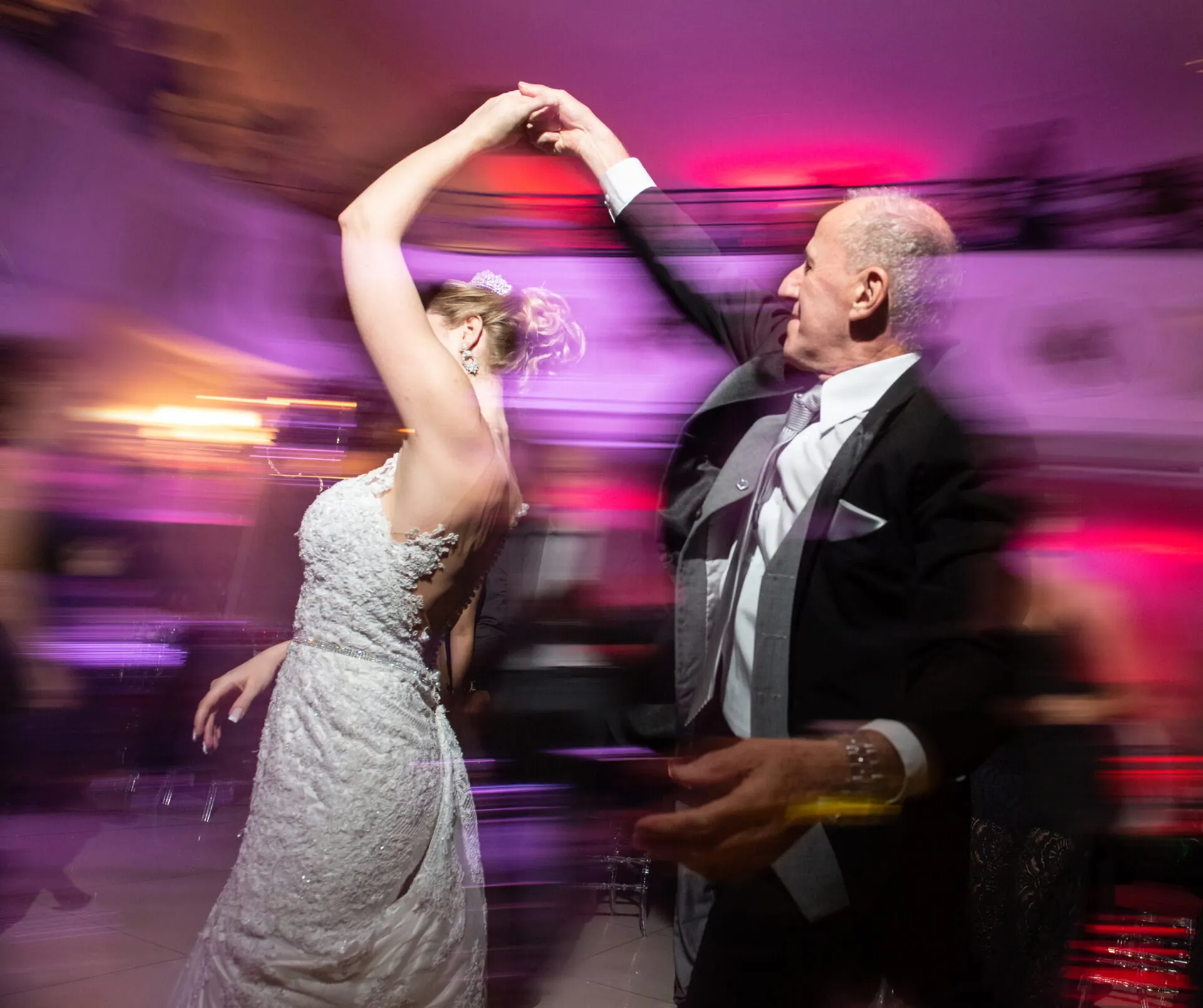 Father-daughter dance at an Austin wedding, lit by string lights